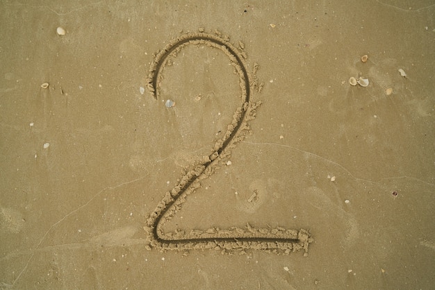 Anzahl in den Sand geschrieben