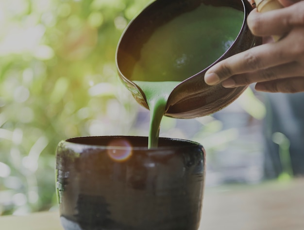 Aroma-Getränk-Frische Maccha-strömendes Konzept des Tee-aromatischen Getränkes