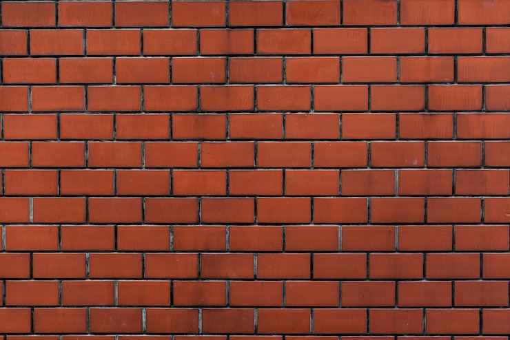 Kostenlose Foto backsteinmauer orange tapetenmuster