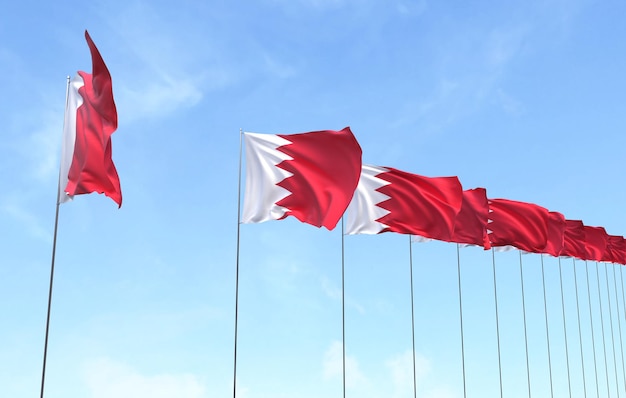 Kostenloses Foto bahrain-flagge weht auf blauem himmelshintergrund