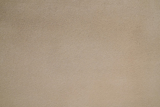 Beige betonwand oberfläche hintergrund textur putz hellbraun sandfarbe
