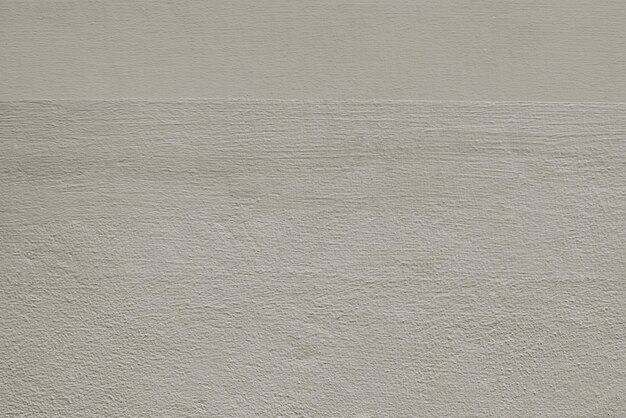 Beige schlichter Beton strukturierter Hintergrund