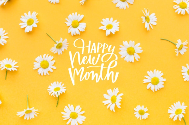 Blumenarrangement mit Happy New Month Schriftzug