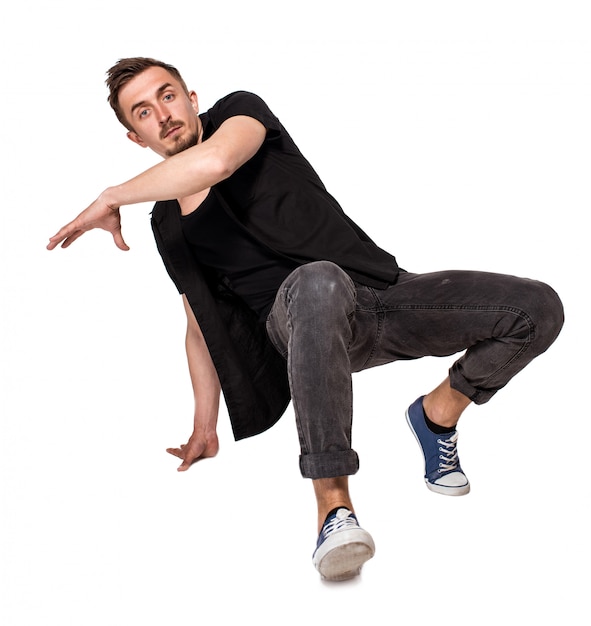 Breakdancer macht einen Handstand vor einem weißen Hintergrund
