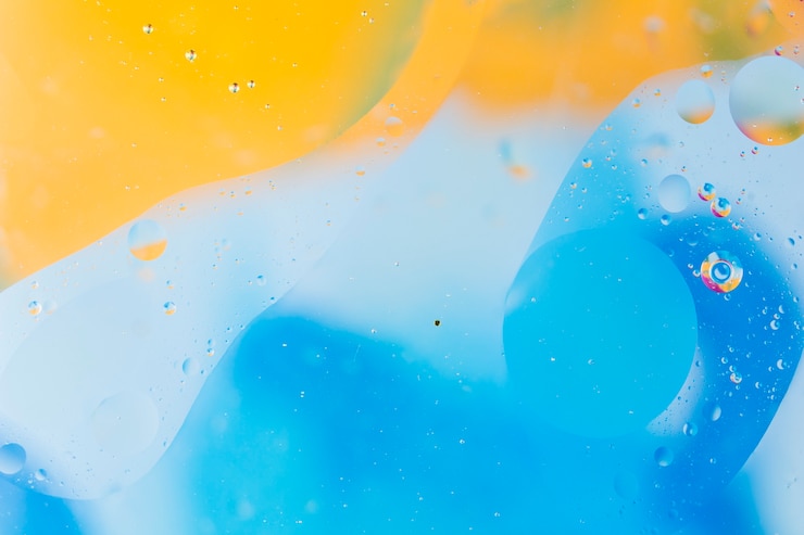 Kostenlose Foto bubbles über die gelbe und blaue wasserfarbe