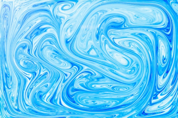 Der Stil der Ebru-Malerei mit blauer Acrylfarbe wirbelt