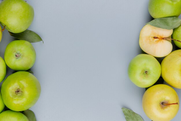 Draufsicht des Schnittmusters und der ganzen Äpfel an den Seiten auf grauem Hintergrund mit Kopierraum
