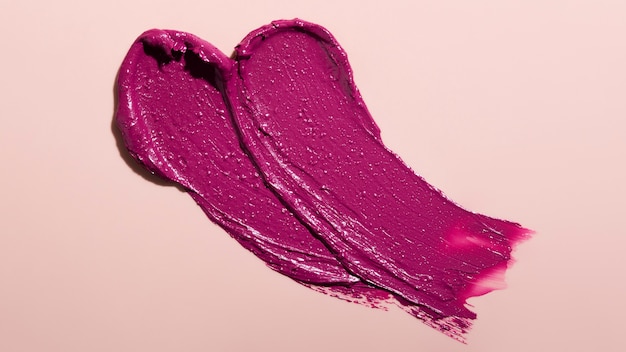 Draufsicht-Lippenstiftschatten auf rosa Hintergrund