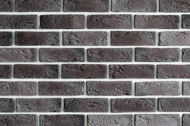 Dunkelbraune Backsteinmauer, kreatives Hintergrundbild, Nahaufnahme