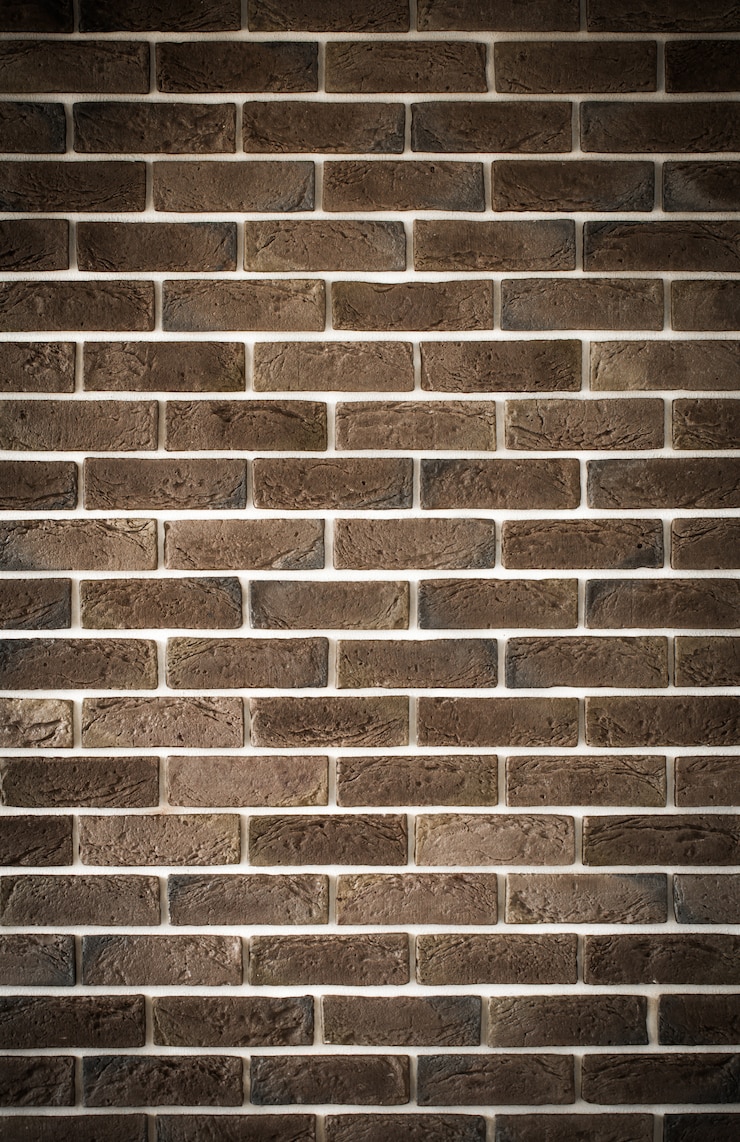 Kostenlose Foto dunkelbraune backsteinmauer, kreatives hintergrundbild, nahaufnahme