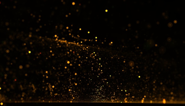 Kostenloses Foto dynamischer hintergrund mit fließendem staub aus goldenen partikeln
