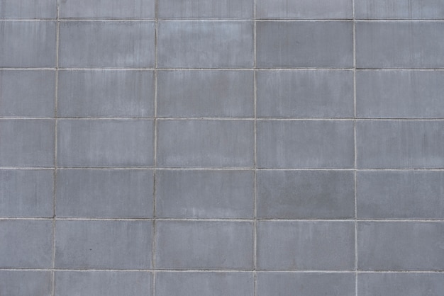 Einfacher grauer Betonmauerhintergrund