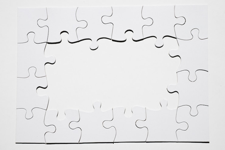 Kostenlose Foto feld gemacht vom weißen puzzlespielstück auf weißem hintergrund