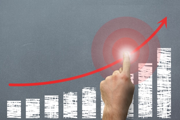 Finger zeigt ein diagramm steigt