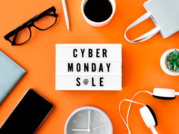 Flache Lage der Cyber-Montag-Lichtbox mit Einkaufstasche und Kaffee