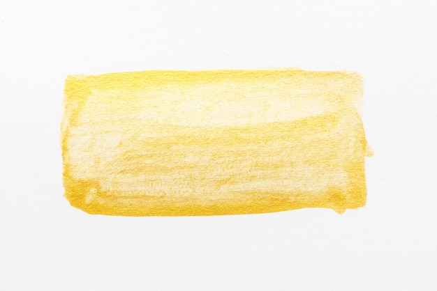 Gelbe abstrakte Aquarellmalerei gemasert auf Weißbuchhintergrund