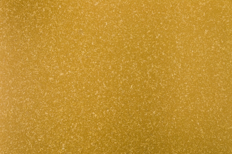 Kostenlose Foto gelbe betonoberfläche mit rauem aussehen