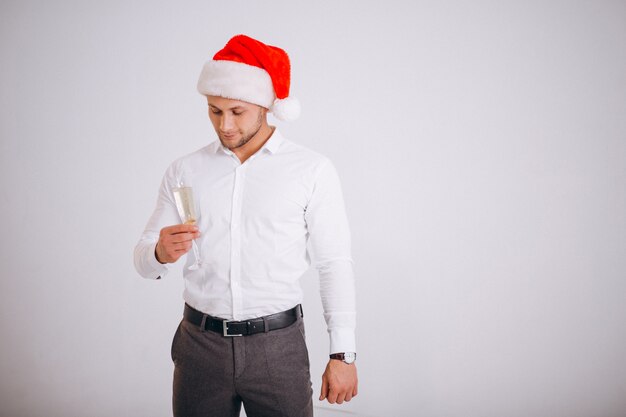 Kostenloses Foto geschäftsmann in sankt-hut mit glas champaigne