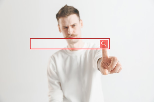 Geschäftsmannfinger, der leere Suchleiste berührt, modernes Geschäftshintergrundkonzept - kann zum Einfügen von Text oder von Bildern verwendet werden.