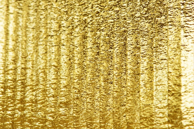 Glänzender goldener strukturierter Papierhintergrund
