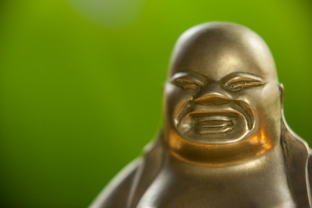 Gold painted Buddha Figur lachend