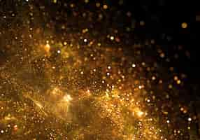 Kostenloses Foto golden partikel burst-hintergrund