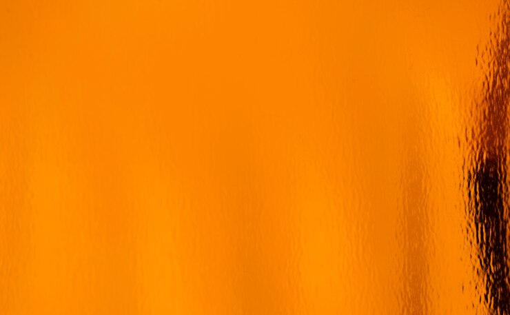 Goldener orangefarbener Texturhintergrund