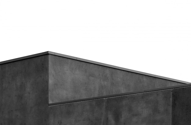 Graustufenaufnahme einer geometrischen grauen Wand