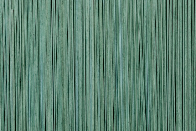 Grüne, ungekochte Tagliatelle strukturierter Hintergrund