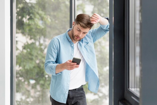 High Angle Man Checking Mobile