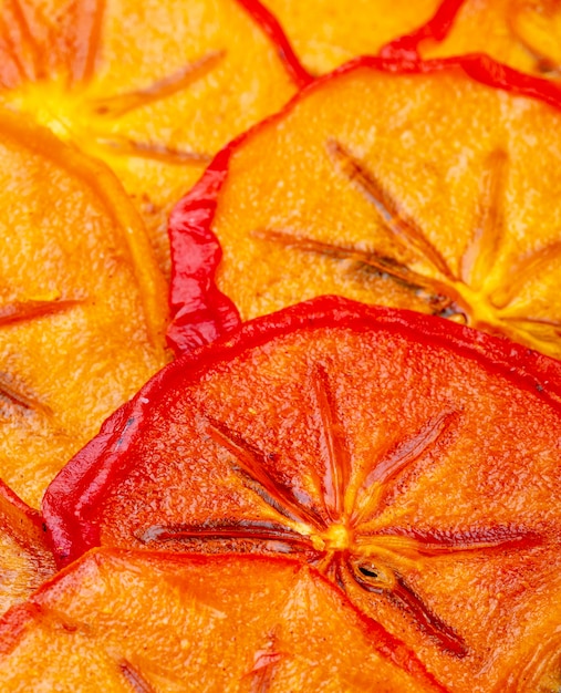 Hintergrund der Seitenansicht der orange getrockneten Persimonenscheiben