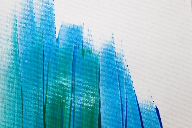 Hintergrund mit grünen und blauen Pinselstrichen
