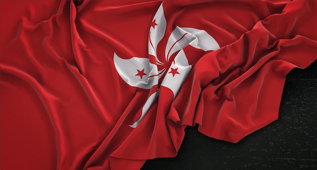 Kostenloses Foto hong kong-flagge geknickt auf dunklem hintergrund 3d render