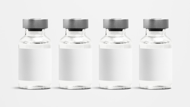 Kostenloses Foto injektionsglasflaschen mit leerem weißem etikett