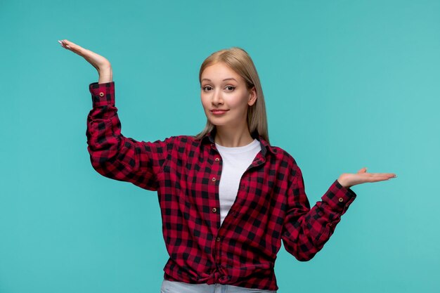 Internationaler Studententag junges hübsches Mädchen in rot kariertem Hemd winkt mit den Händen in der Luft