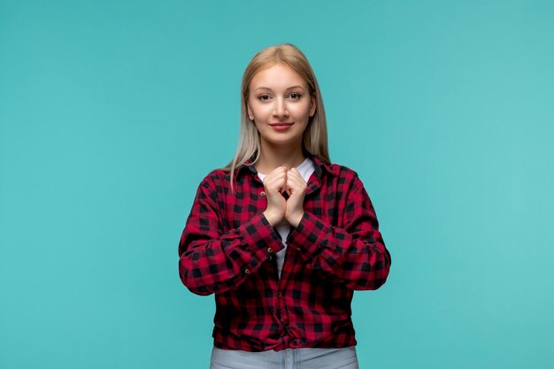Internationaler Studententag junges süßes Mädchen in rot kariertem Hemd, das Händchen hält