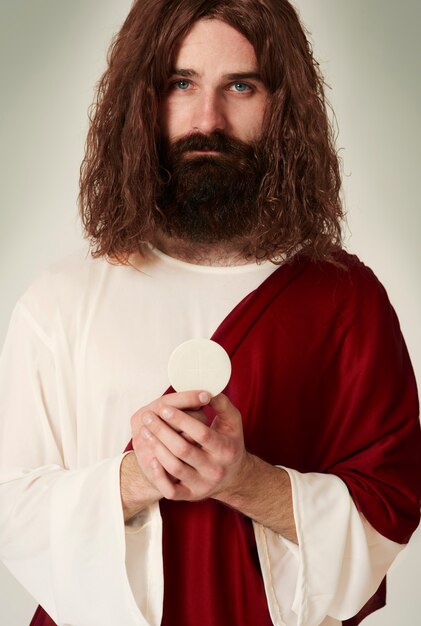Jesus mit dem heiligen Gegenstand, der Hostie ist