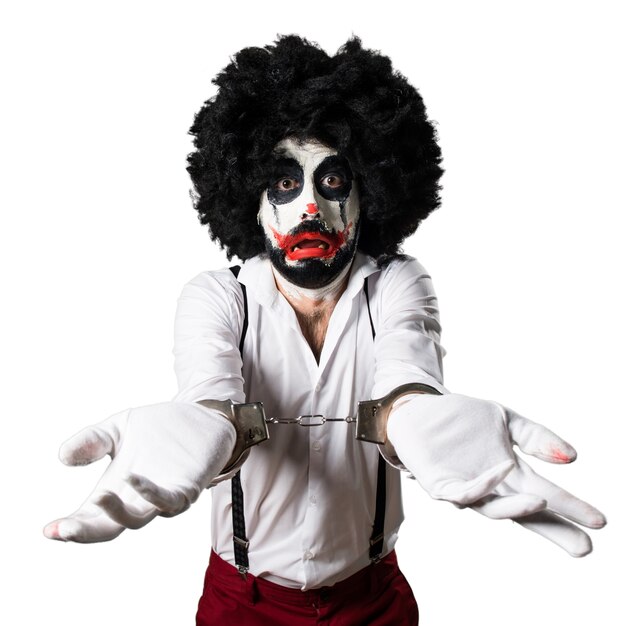 Killer-Clown mit Handschellen