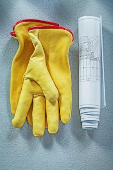 Konstruktionszeichnungen für schutzhandschuhe auf betonoberflächenkonstruktionskonzept.