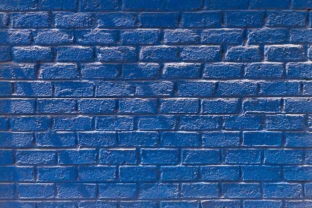 Kopieren Sie die Vorderansicht der blauen Backsteinmauer