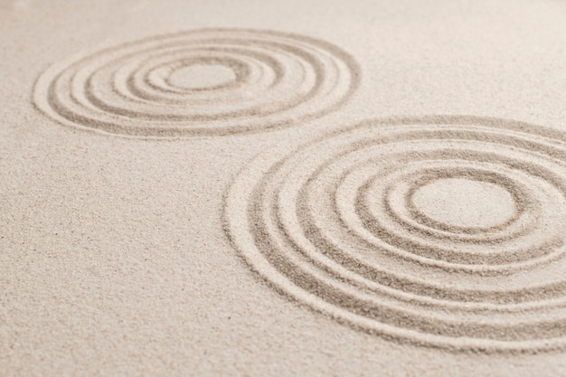 Kreisen Sie Zen-Sandhintergrund im Achtsamkeitskonzept ein