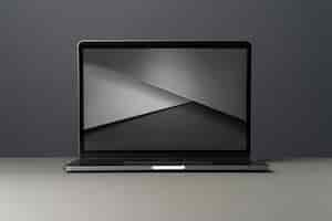 Kostenloses Foto laptop-gerät mit minimalistischem monochromem hintergrund