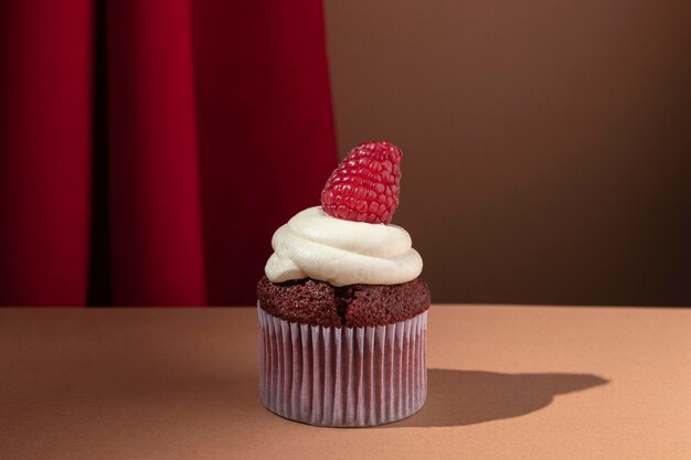 Leckerer Cupcake mit Himbeere