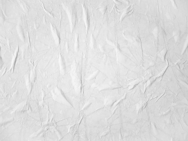 Leere weiße papierstruktur an der wand geklebt