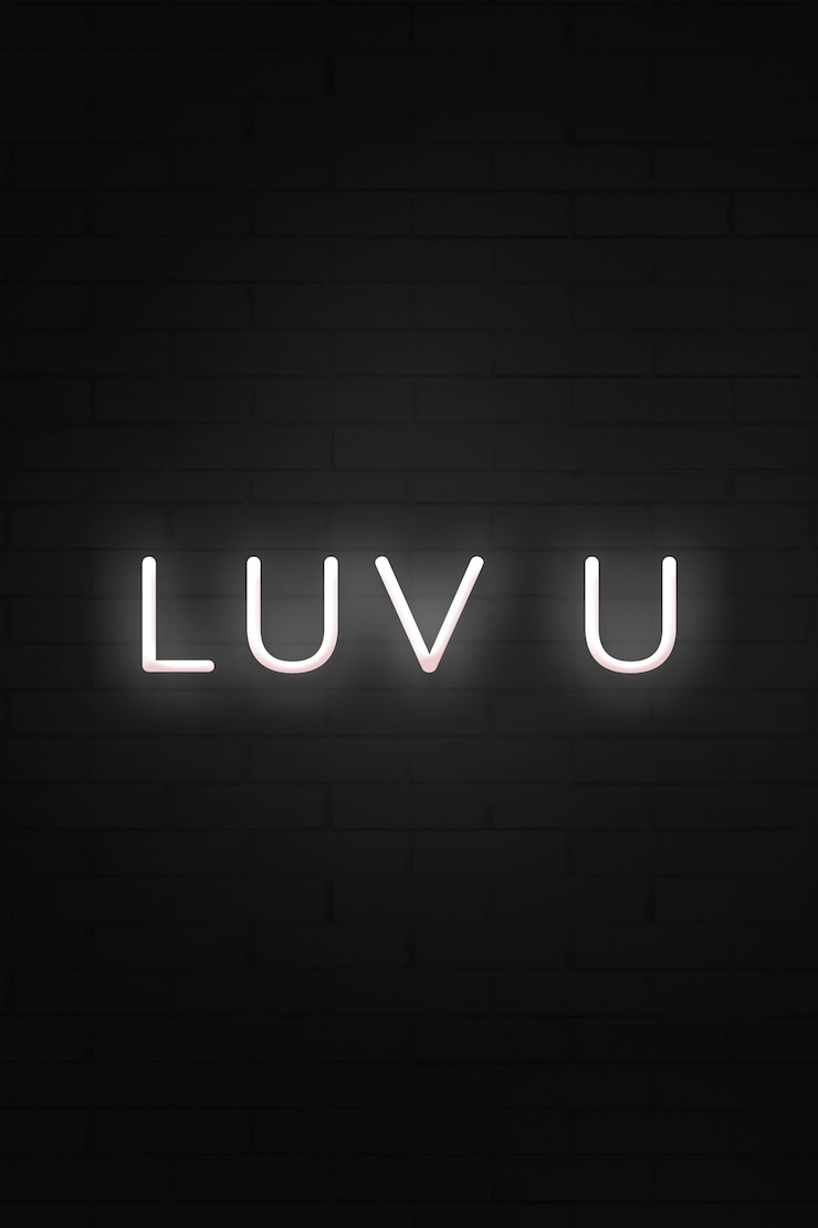 Kostenlose Foto leuchtende luv u neon-typografie auf einem schwarzen hintergrund
