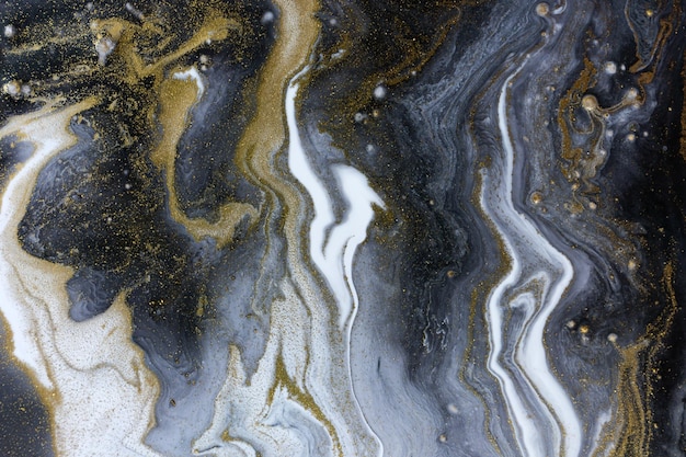 Marmorgrauer und schwarzer abstrakter acrylhintergrund mit goldstaub