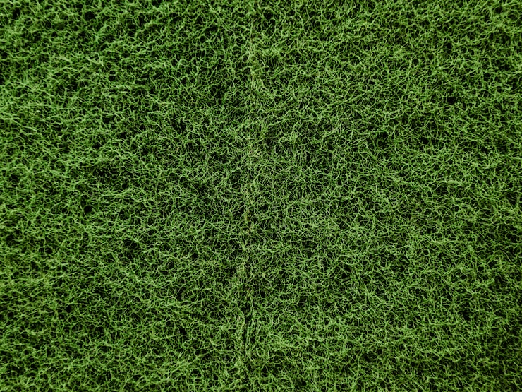 Kostenlose Foto mattenhintergrund des grünen grases