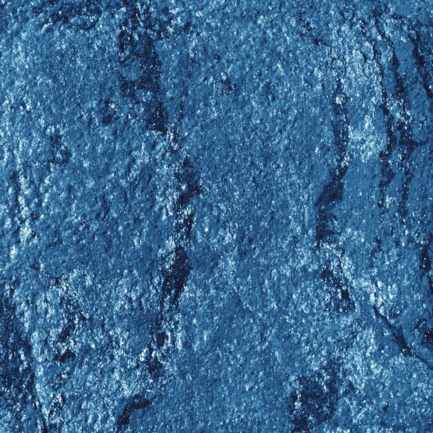 Metallischer Hintergrund des blauen Papiers