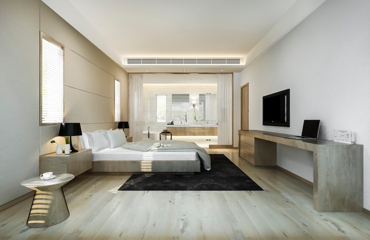 Kostenlose Foto moderne luxuriöse schlafzimmersuite und badezimmer mit arbeitstisch