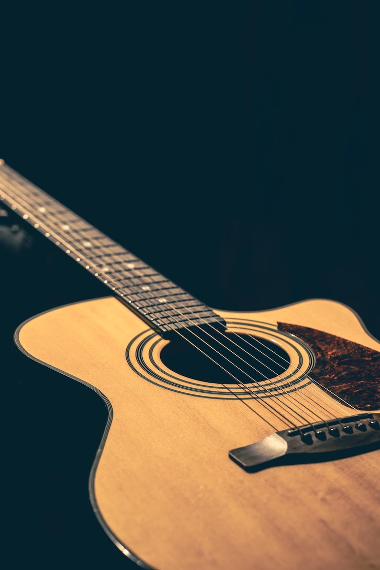 Kostenlose Foto musikalischer hintergrund mit akustischer gitarre in nahaufnahme
